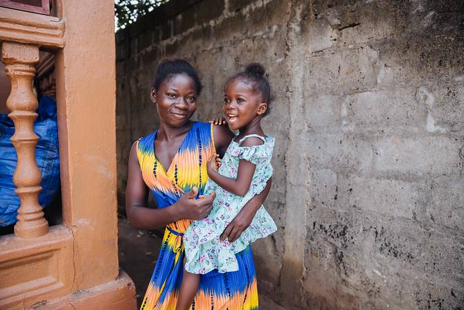 Girl with mother after tumour removed