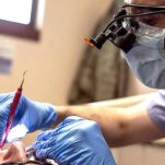 Dental surgeon treating patient