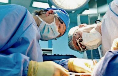 Consultant and assistant surgeons in theatre