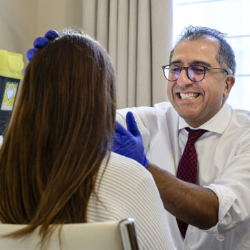 maxillofacial consultant assessing patient