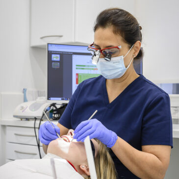 hygienist treating patient