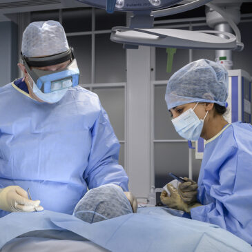 maxillofacial surgeon in operating theatre