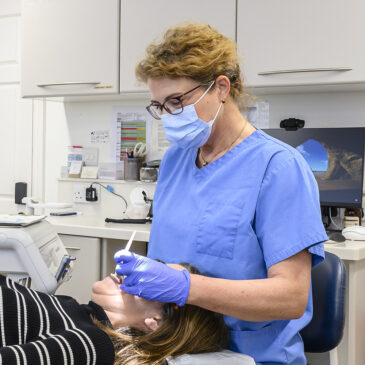 orthodontist treating patient