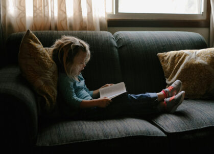 child reading book