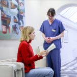 patient chatting with nurse in waiting area