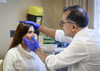 maxillofacial consultant Professor Kaveh Shakib with patient