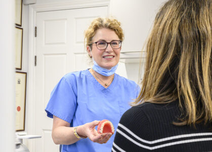 orthodontist Dr Sarah Neale talking with patient